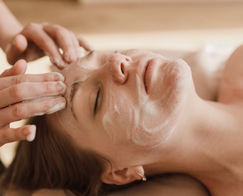 a woman having a facial treatment